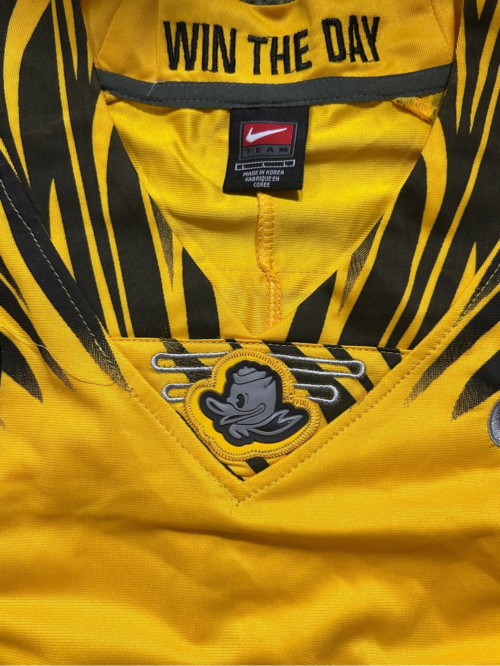 Oregon Ducks Nike Yellow and Black Performance Jersey with 'Win The Day' Detail